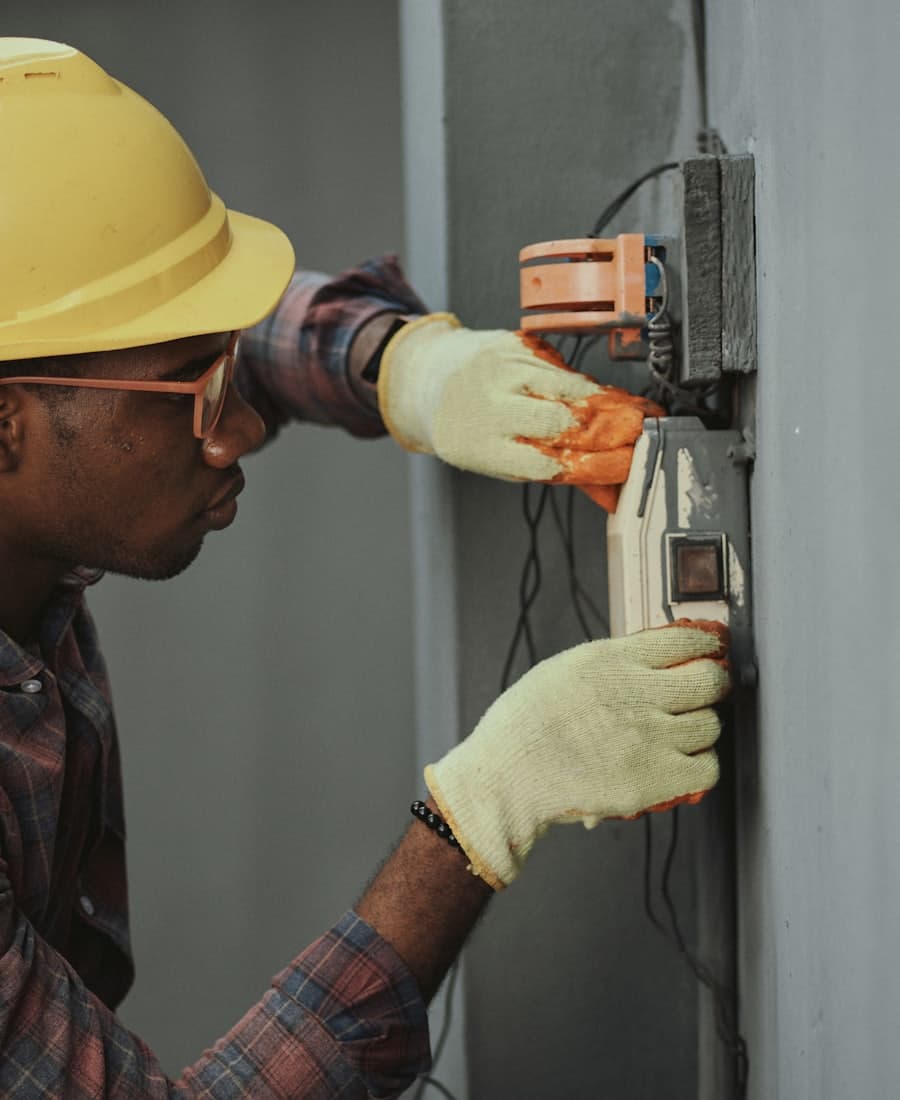 Electrician testing a switchboard